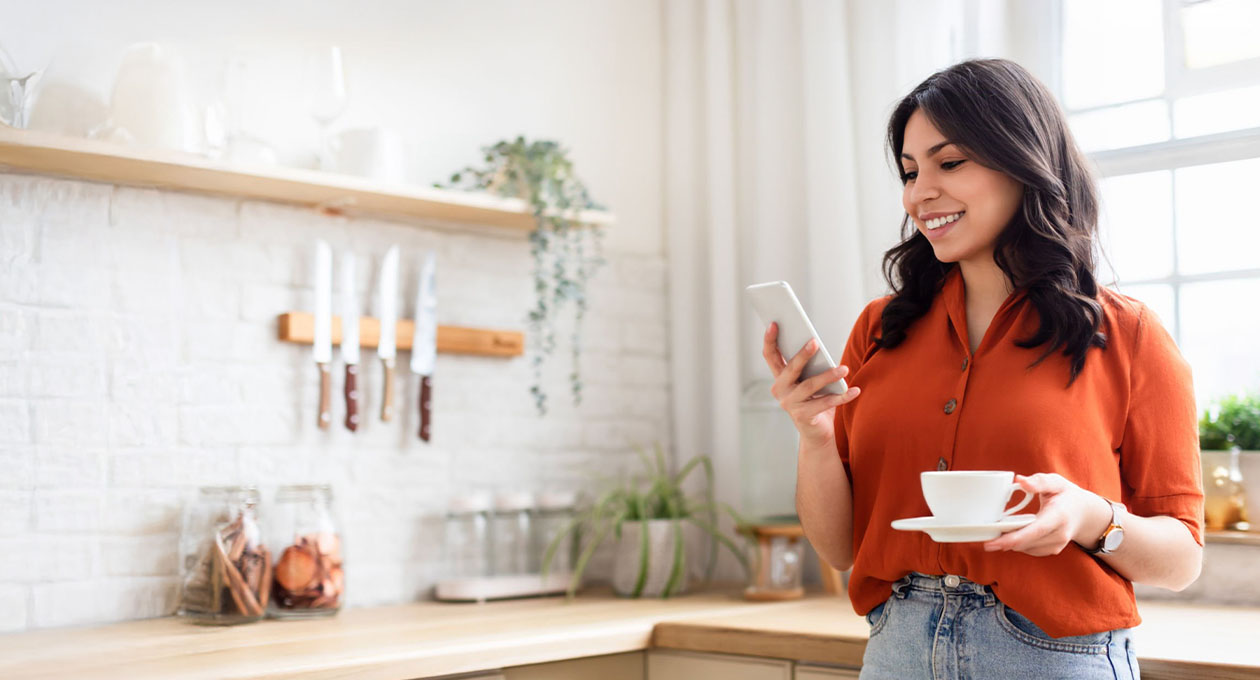 iPhone, top part of screen showing home screen with Weather and Find My widgets in the top row